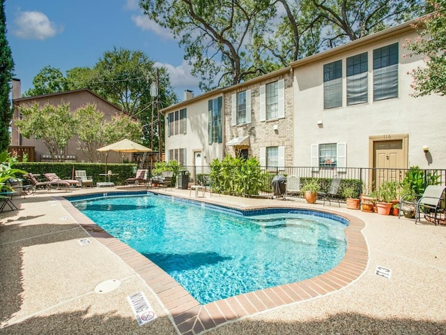 3817 Rawlins St Unit 103, Dallas, TX 75219 - community pool featuring fence and a patio