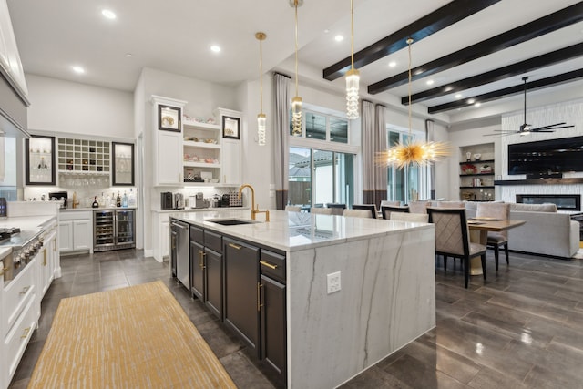 13420 Tim Tam Cir, Frisco, TX 75035 - kitchen featuring a sink, light stone counters, hanging light fixtures, and white cabinetry