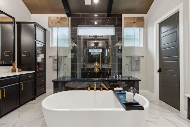 13420 Tim Tam Cir, Frisco, TX 75035 - full bathroom featuring a freestanding bath, marble finish floor, baseboards, a healthy amount of sunlight, and a stall shower
