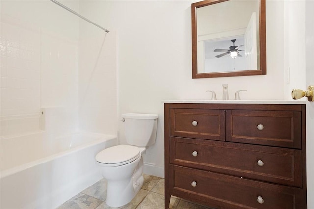 bathroom featuring shower / bath combination, ceiling fan, vanity, baseboards, and toilet