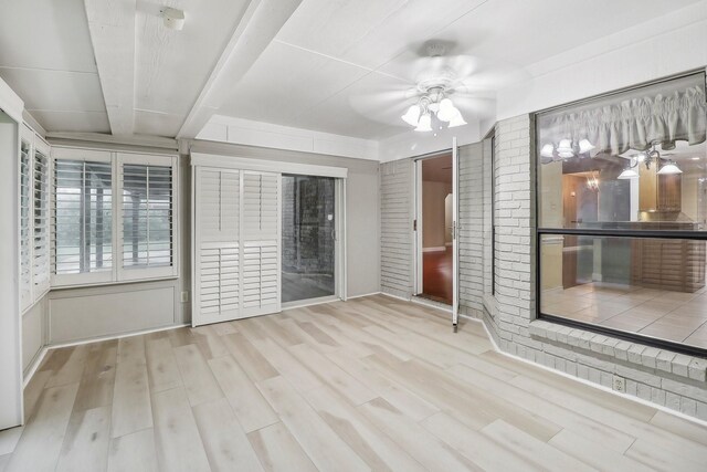 spare room featuring ceiling fan and wood finished floors
