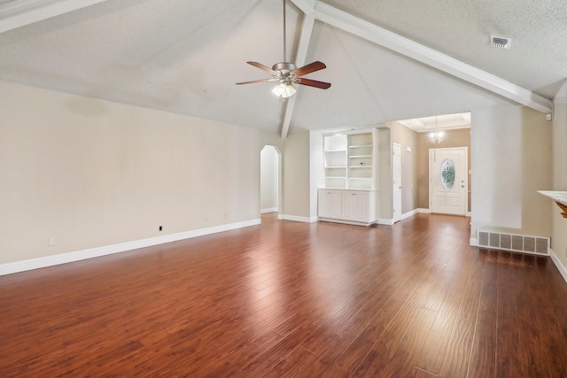 unfurnished living room with visible vents, a ceiling fan, baseboards, and beam ceiling