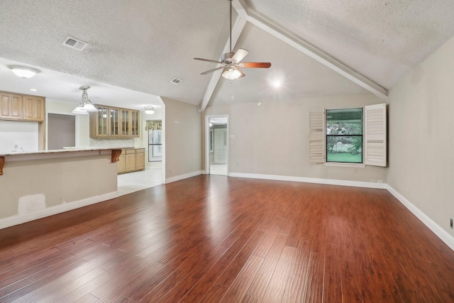 unfurnished living room featuring light wood-style floors, a ceiling fan, a textured ceiling, and visible vents