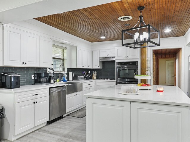 2802 Cinnamon Springs Rd, Glenn Heights, TX 75154 - kitchen with stainless steel dishwasher, a sink, under cabinet range hood, and white cabinets