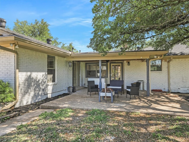 2802 Cinnamon Springs Rd, Glenn Heights, TX 75154 - back of property featuring brick siding, a patio area, and roof with shingles