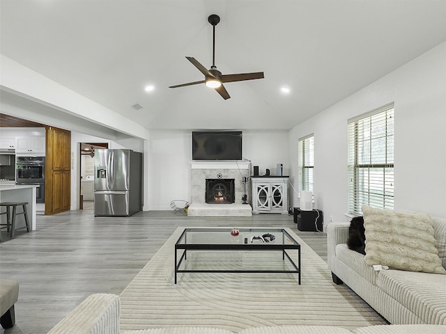 2802 Cinnamon Springs Rd, Glenn Heights, TX 75154 - living area featuring a premium fireplace, a ceiling fan, recessed lighting, and light wood-style flooring