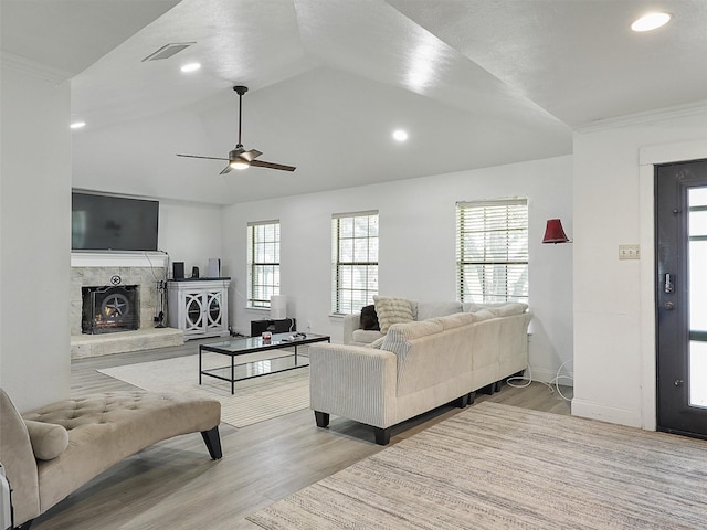 2802 Cinnamon Springs Rd, Glenn Heights, TX 75154 - living area with ceiling fan, visible vents, a fireplace, wood finished floors, and vaulted ceiling