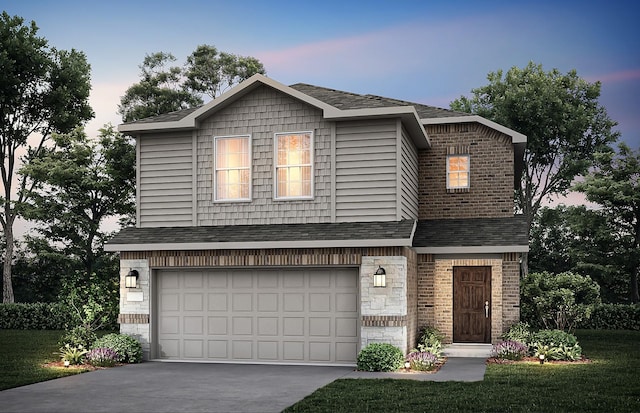 traditional-style house with concrete driveway, a shingled roof, and a garage
