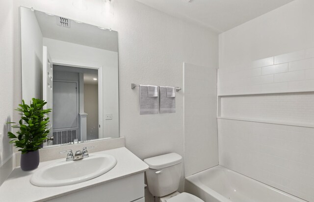 full bath featuring vanity, visible vents, toilet, and shower / washtub combination