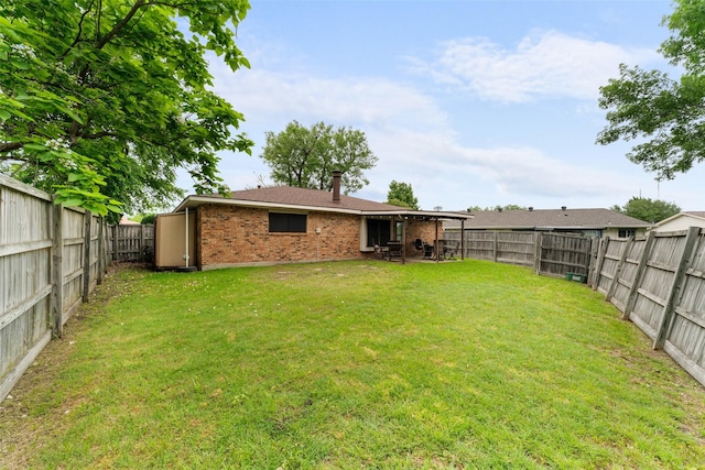 view of yard featuring a fenced backyard and a patio area