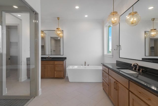 1401 Enchanted Way, Lucas, TX 75002 - full bath featuring a sink, a soaking tub, recessed lighting, and two vanities