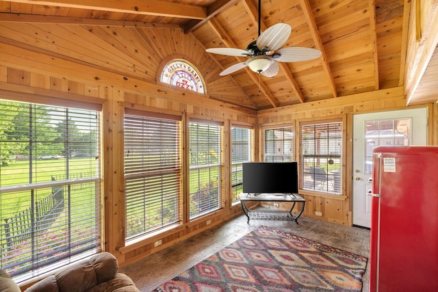 interior space with wooden walls, wooden ceiling, vaulted ceiling with beams, and wood finished floors