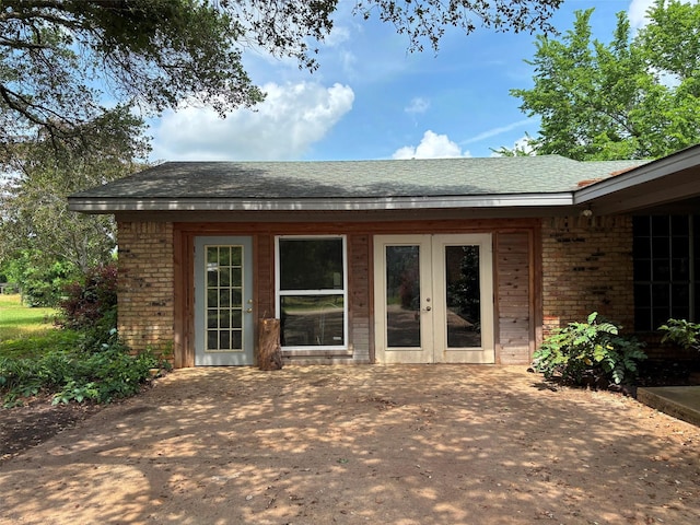 46916 US Highway 69 N, Bullard, TX 75757 - rear view of house featuring french doors, a shingled roof, and brick siding