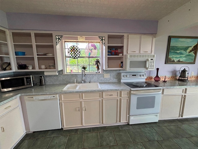 46916 US Highway 69 N, Bullard, TX 75757 - kitchen with open shelves, white appliances, light countertops, dark tile patterned flooring, and a sink
