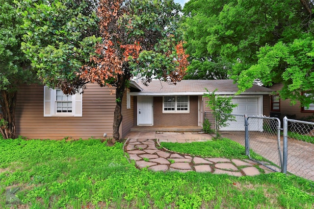 890 Sammons St, Abilene, TX 79605 - view of front facade featuring driveway, a garage, brick siding, fence, and a shingled roof
