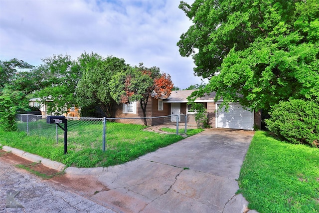 890 Sammons St, Abilene, TX 79605 - view of front of home featuring a garage, a fenced front yard, driveway, and a front yard