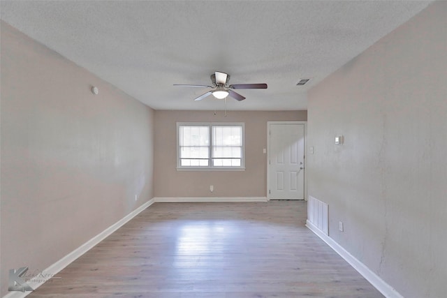 890 Sammons St, Abilene, TX 79605 - spare room with visible vents, baseboards, ceiling fan, and wood finished floors