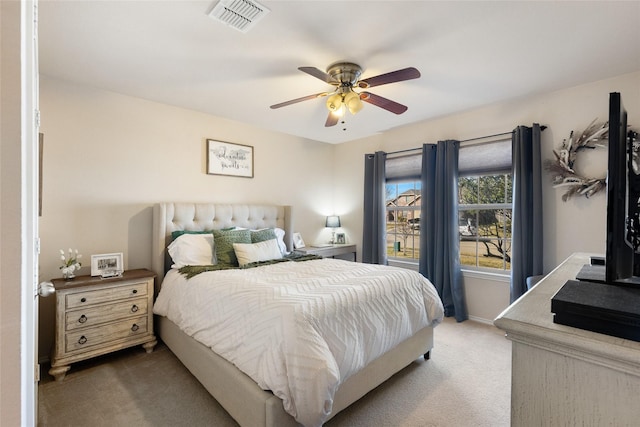 bedroom featuring carpet floors, ceiling fan, visible vents, and baseboards