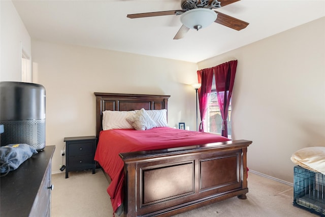 bedroom featuring baseboards, ceiling fan, and light colored carpet