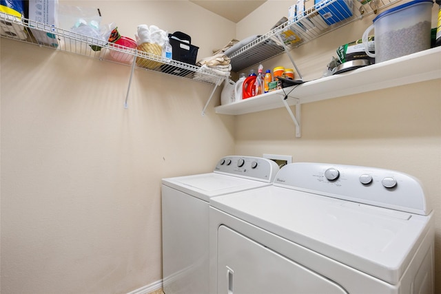laundry room featuring laundry area and washer and clothes dryer