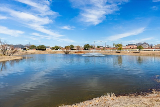 property view of water with fence and a residential view