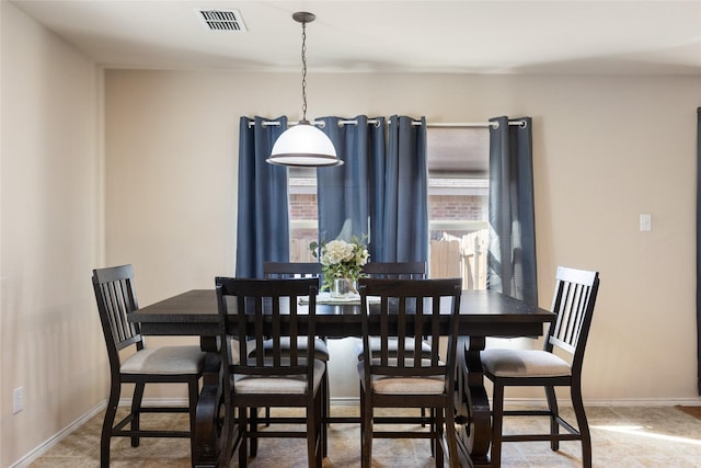 dining area featuring baseboards and visible vents