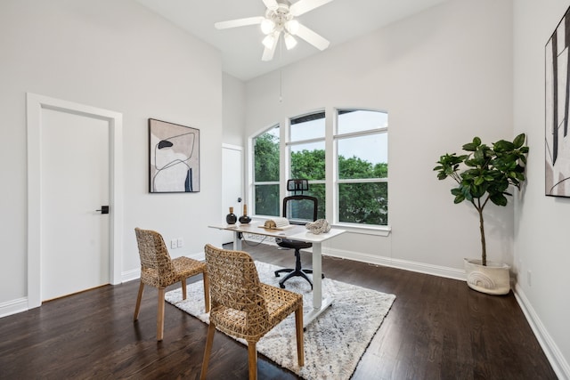 office space featuring high vaulted ceiling, ceiling fan, baseboards, and wood finished floors