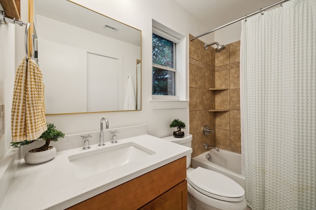 full bath with toilet, visible vents, shower / bath combo, and vanity