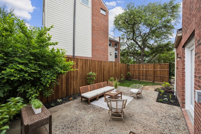 view of patio featuring a fenced backyard and an outdoor living space