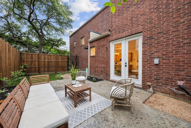 view of patio featuring a fenced backyard and french doors