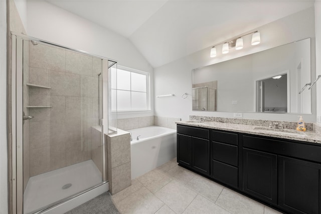 full bathroom with a garden tub, a sink, lofted ceiling, and a stall shower