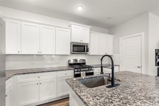 517 Williams Way, Van Alstyne, TX 75495 - kitchen with a sink, dark stone countertops, and stainless steel appliances