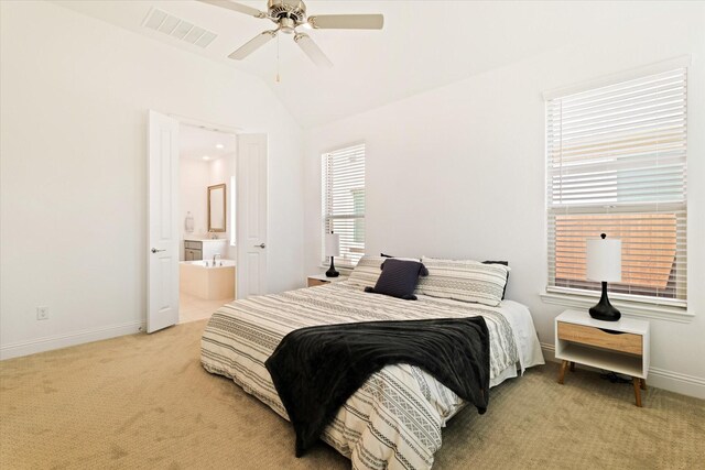 bedroom featuring baseboards, visible vents, light carpet, and lofted ceiling