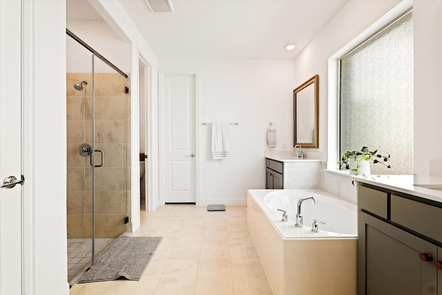 bathroom with vanity, visible vents, a garden tub, and a stall shower