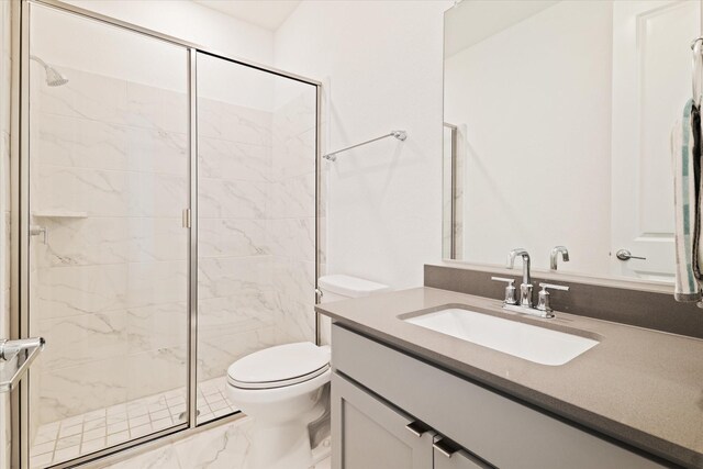 full bathroom with vanity, a shower stall, toilet, and marble finish floor