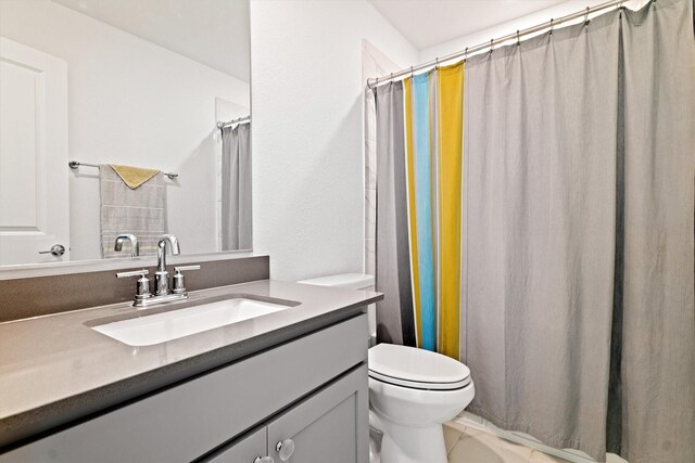 full bathroom with vanity and toilet
