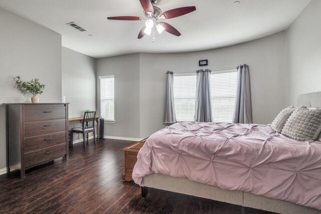 bedroom featuring a ceiling fan, baseboards, visible vents, and dark wood-type flooring