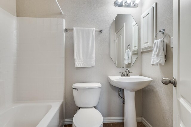 full bath with a sink, shower / bathtub combination, and toilet