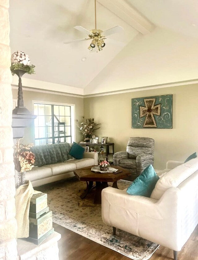 living area featuring beamed ceiling, a ceiling fan, high vaulted ceiling, and wood finished floors