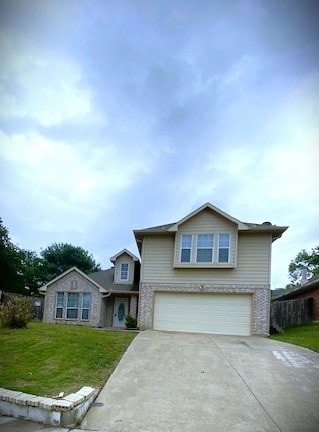914 Gallant Fox Dr, Dallas, TX 75211 - traditional-style house featuring fence, an attached garage, driveway, and a front yard