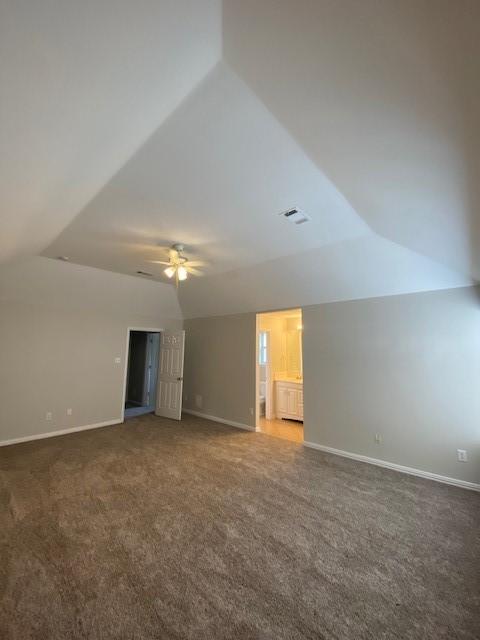 914 Gallant Fox Dr, Dallas, TX 75211 - interior space featuring carpet floors, ceiling fan, baseboards, and vaulted ceiling