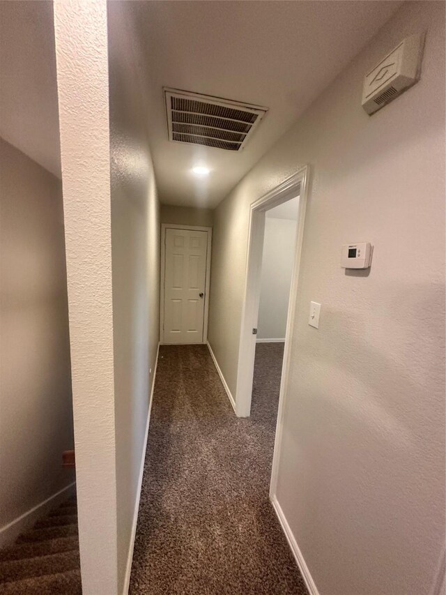 914 Gallant Fox Dr, Dallas, TX 75211 - unfurnished bedroom with visible vents, a closet, baseboards, dark carpet, and a ceiling fan