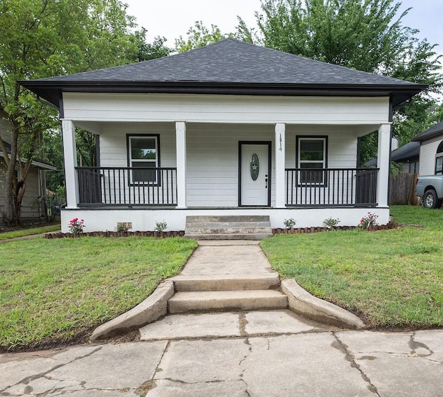 1014 W Morgan St, Denison, TX 75020 - bungalow-style home with covered porch, roof with shingles, and a front yard