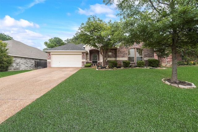 view of front of property with an attached garage, concrete driveway, a front yard, and brick siding