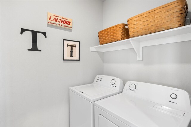 laundry room featuring laundry area and washer and clothes dryer
