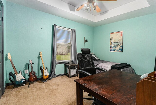 303 Valley View Ct, Rio Vista, TX 76093 - bedroom with light colored carpet, a ceiling fan, baseboards, and a raised ceiling