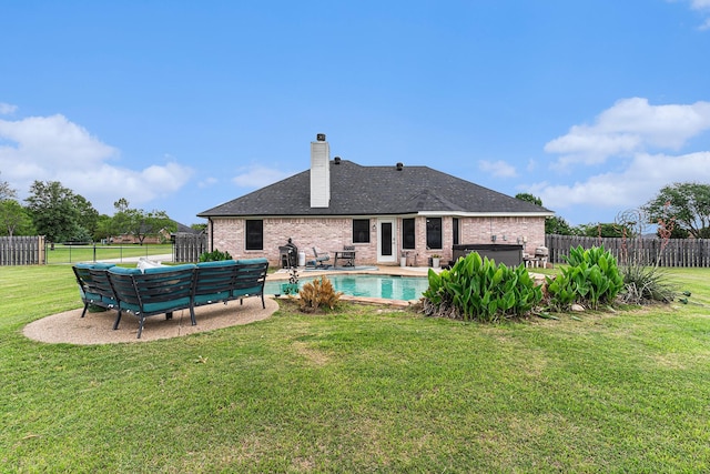 303 Valley View Ct, Rio Vista, TX 76093 - rear view of property with brick siding, a fenced backyard, a fenced in pool, a chimney, and a lawn