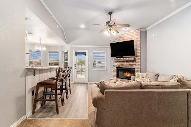 303 Valley View Ct, Rio Vista, TX 76093 - living area with baseboards, light wood finished floors, plenty of natural light, and ceiling fan with notable chandelier