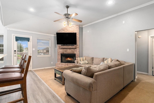 303 Valley View Ct, Rio Vista, TX 76093 - living area with a ceiling fan, a fireplace, crown molding, and vaulted ceiling