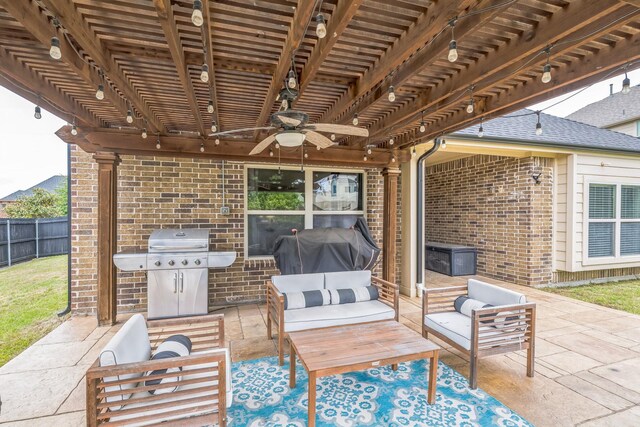 view of patio / terrace with area for grilling, an outdoor living space, a ceiling fan, fence, and a pergola
